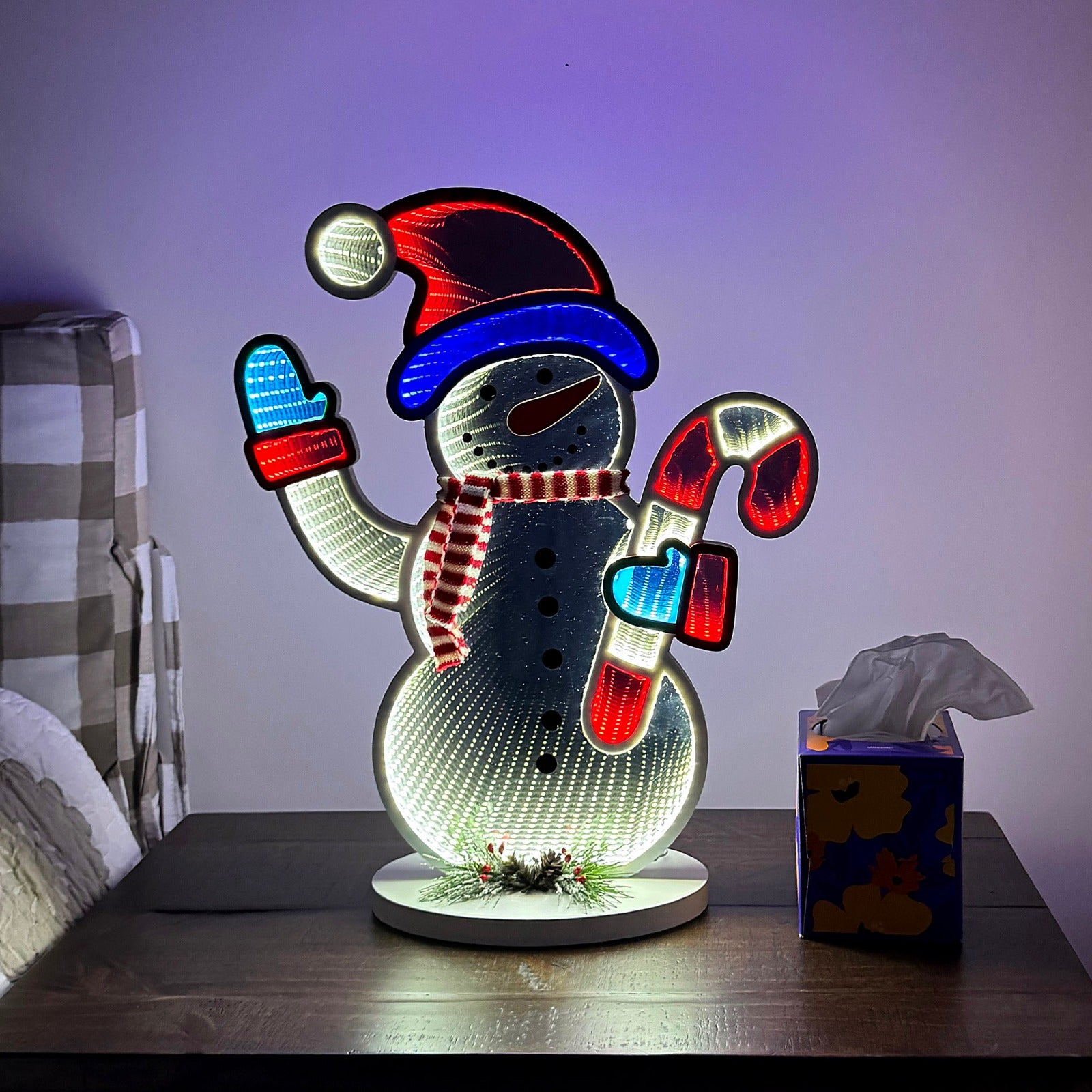 Christmas snowman infinity mirror light with LED lights and endless depth effect. USB powered holiday decor, larger size, made from mirrored acrylic and foam board. Perfect for indoor use around the Christmas tree or as festive tabletop decoration.