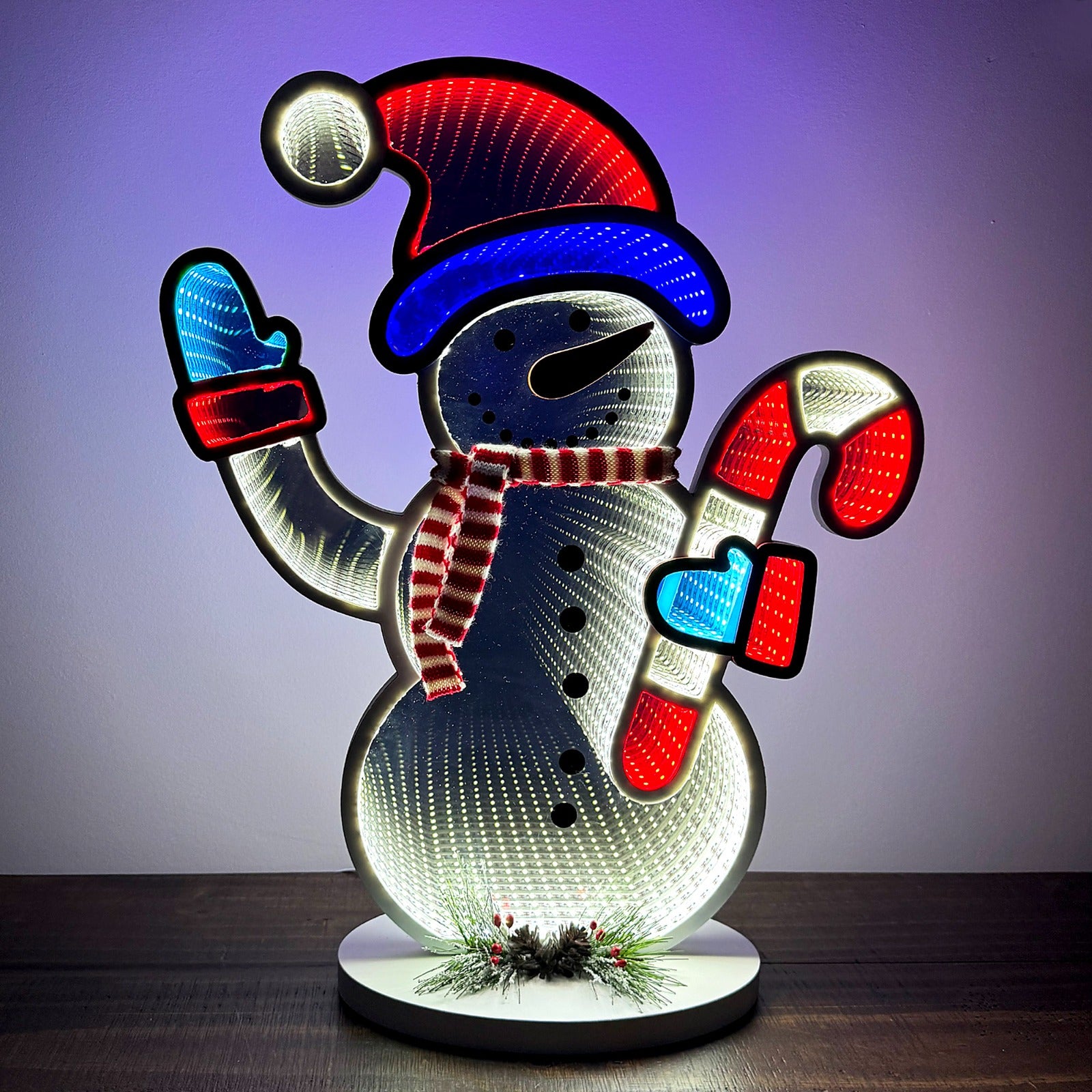 Christmas snowman infinity mirror light with LED lights and endless depth effect. USB powered holiday decor, larger size, made from mirrored acrylic and foam board. Perfect for indoor use around the Christmas tree or as festive tabletop decoration.